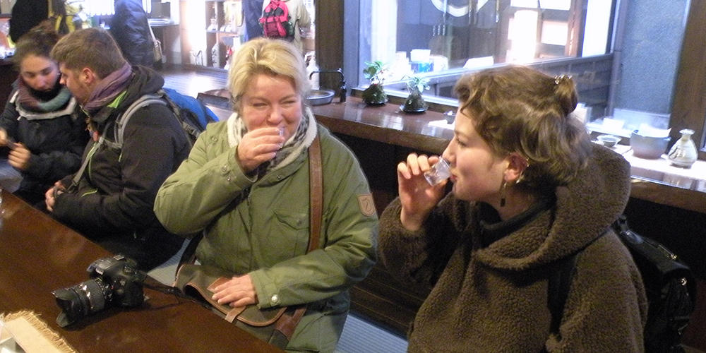 two women drinking sake