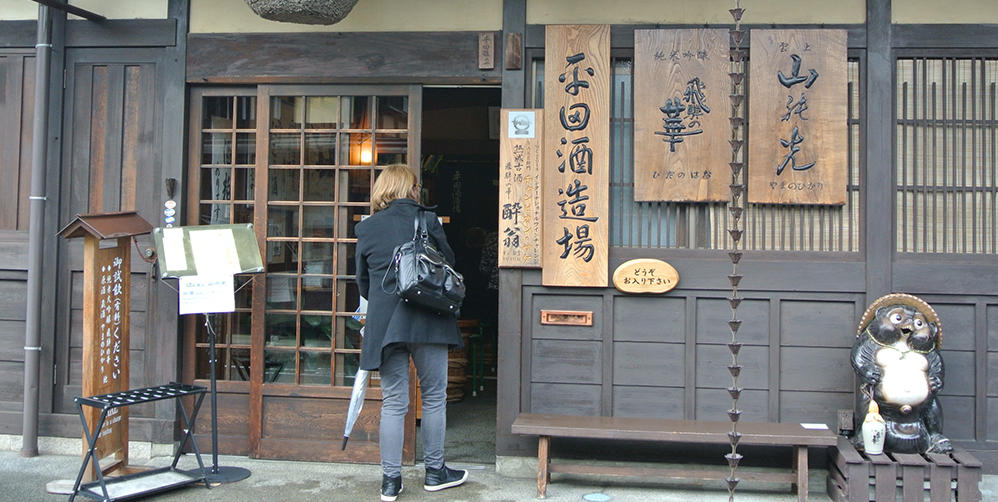 woman entering a shop